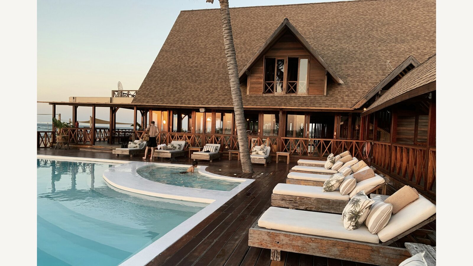 A hotel swimming pool and surrounding buildings