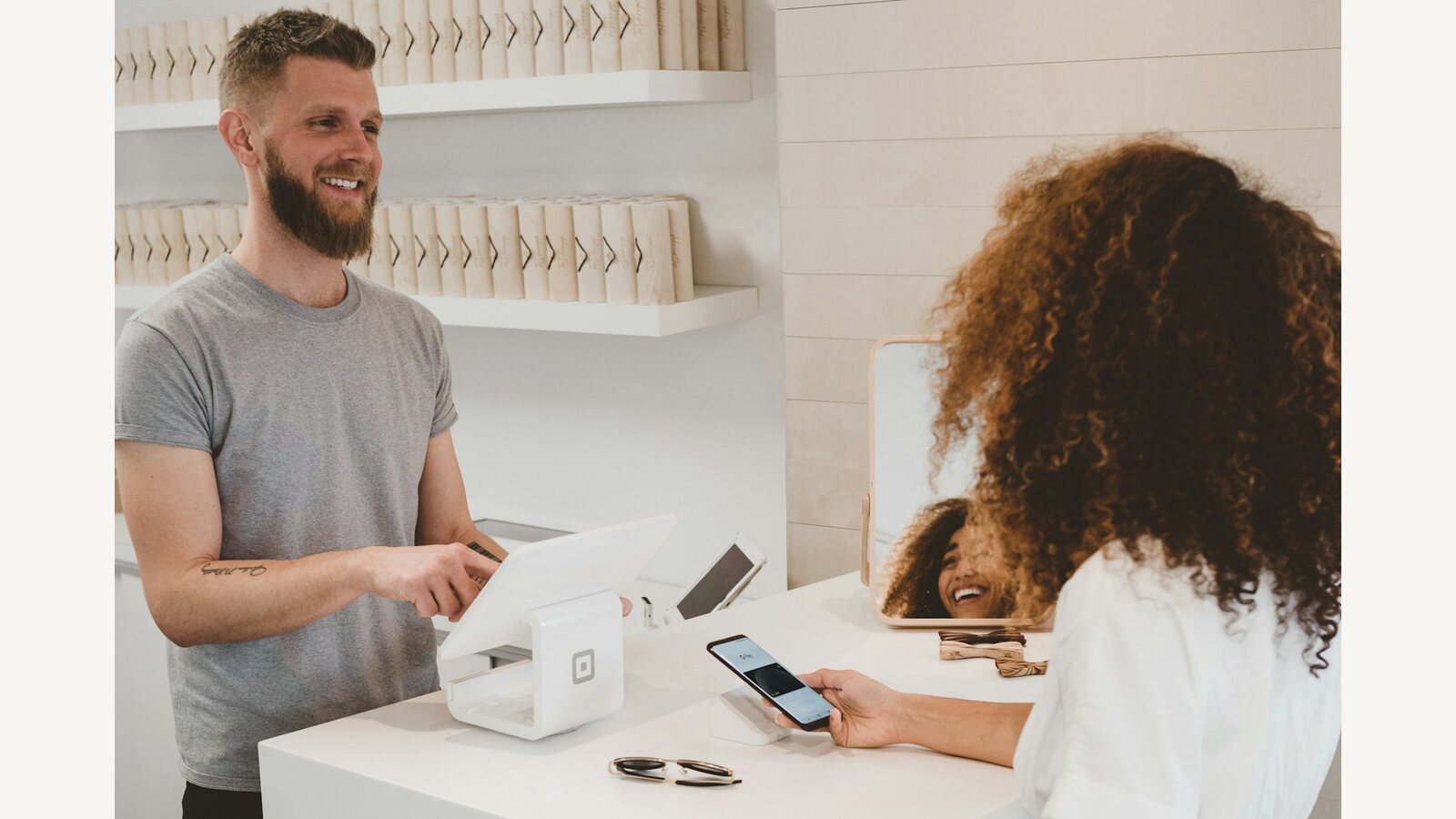 A customer at a retail counter