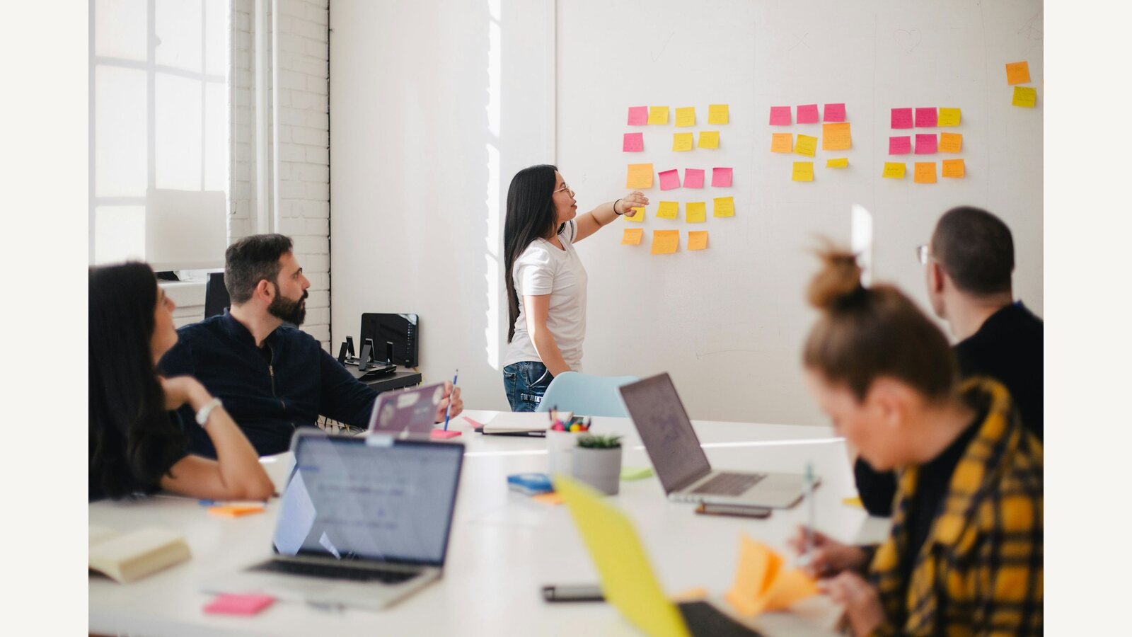 A workshop team organizing sticky notes