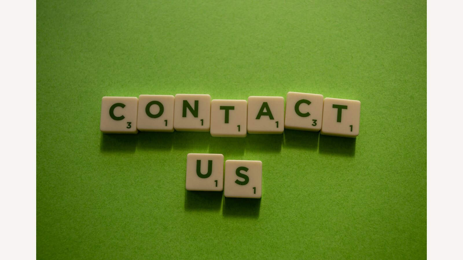 Letter tiles spelling Contact Us