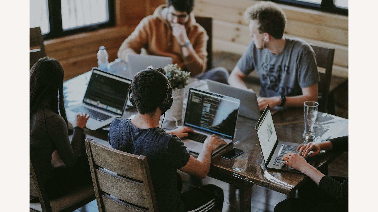 A team meeting around laptops
