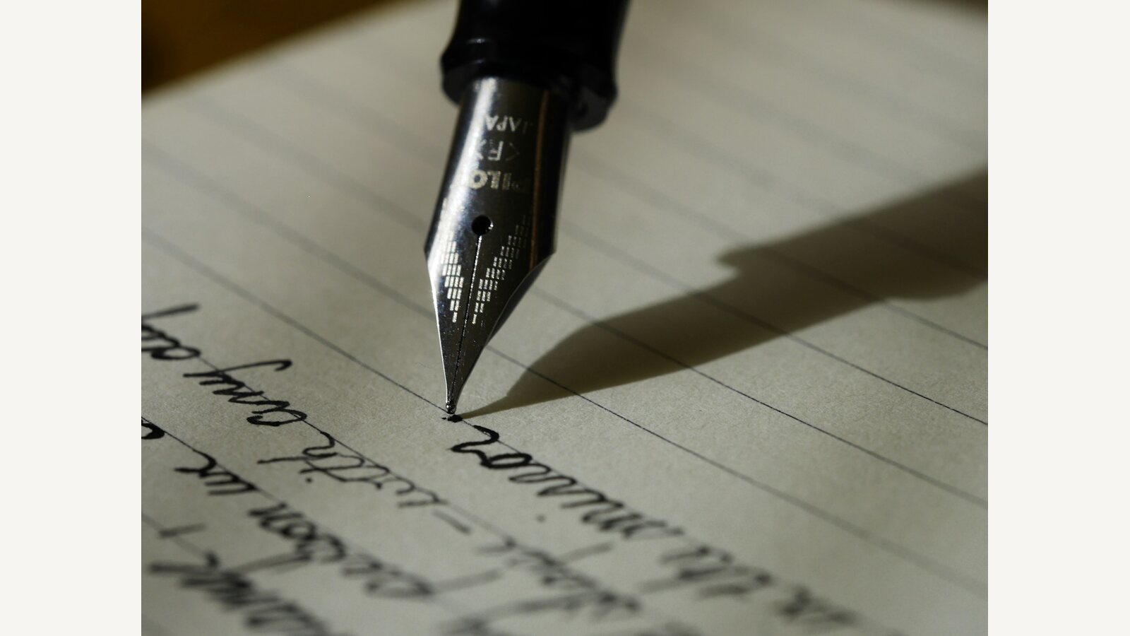 A fountain pen resting on paper